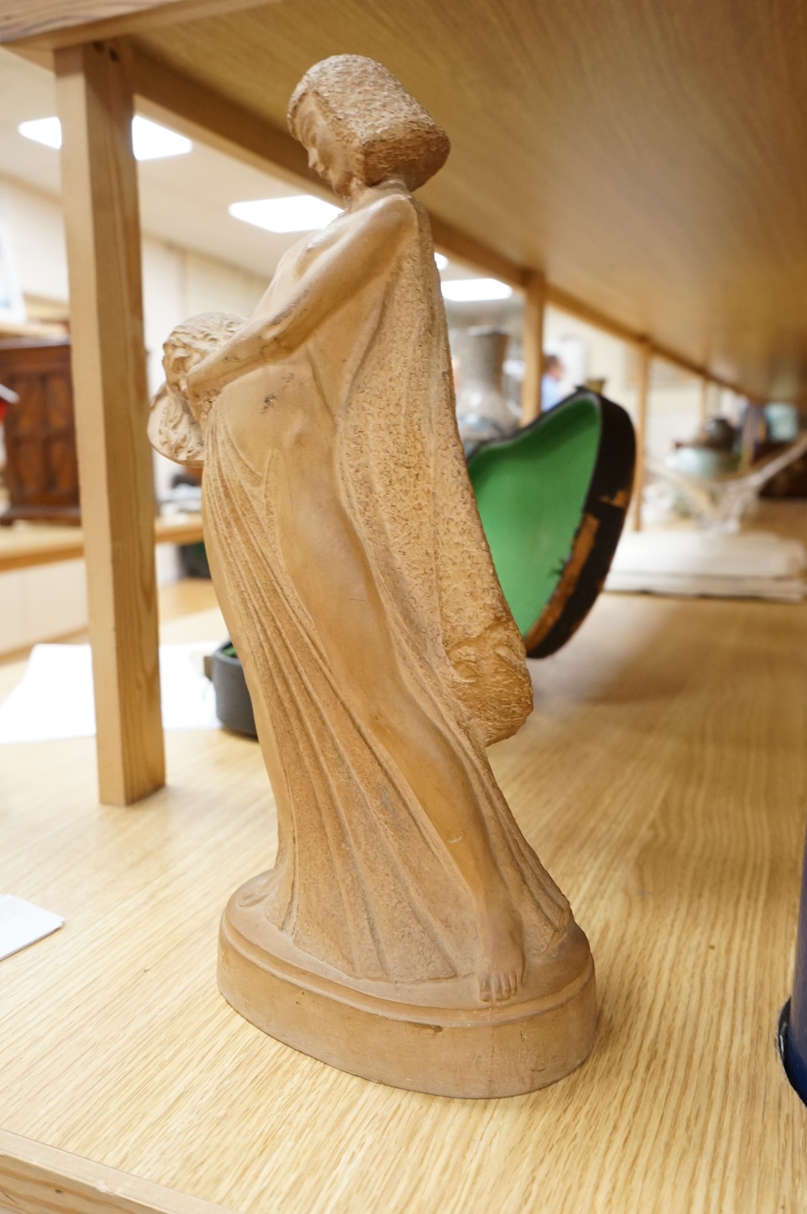 ZFW, a terracotta figure of a classical maiden, signed and dated ‘43, 36cm high